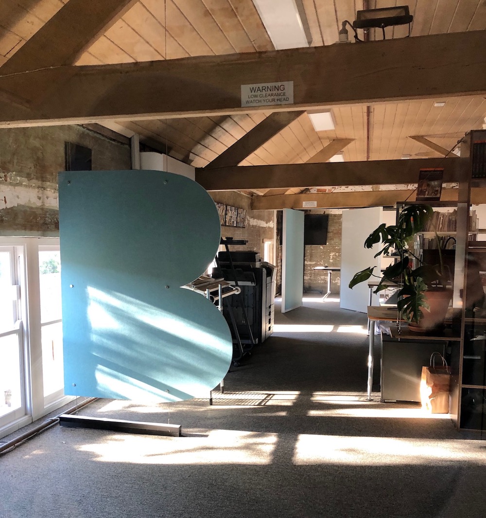 studio b offices with a big letter b in the middle of the room 