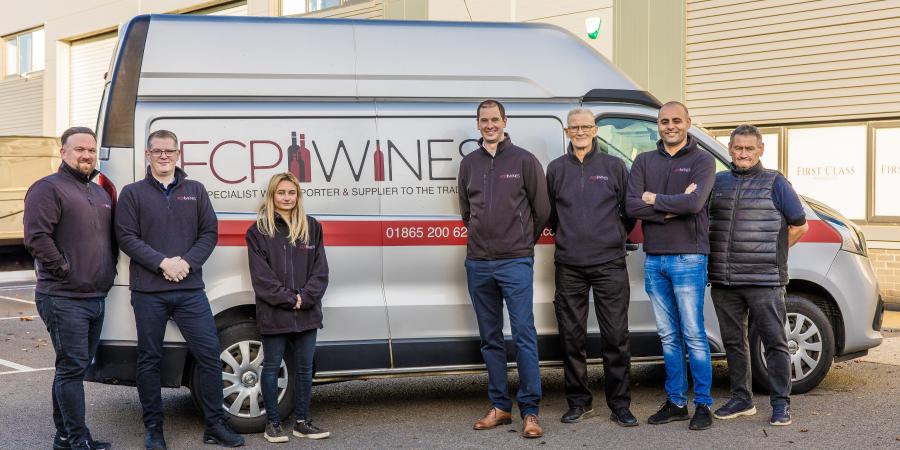 FCP team standing buy their van 