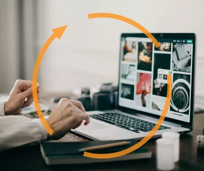 A person working on a laptop with an update status icon overlayed