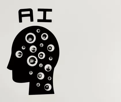 A head silhouette with eyes on it and ai written above it 