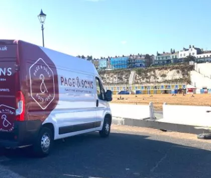 Page and sons van parked over looking a hill 