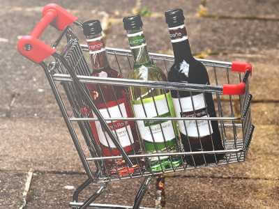 Shopping trolley filled with bottles of wine